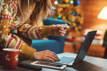 Woman doing online shopping at Christmas