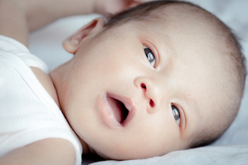Portrait of cute Asian baby, concept create newborn, selective focus at the eyes.