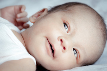 Portrait of cute Asian baby, concept create newborn, selective focus at the eyes.