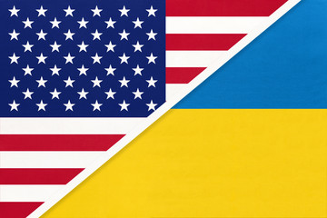 USA vs Ukraine national flag from textile. Relationship between american and european countries.