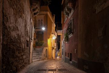 Street lights in the ancient medieval baroque city Ragusa at night in Sicily, south Italy