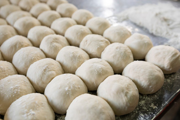 Fototapeta na wymiar Roti dough divided into ball arranged on table