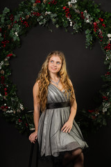 Fototapeta na wymiar Girl in New Year's decor and a beautiful dress.