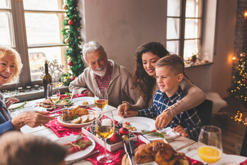 Happy family having Christmas dinner