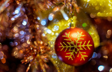 Obraz na płótnie Canvas Close up Chistmas tree and New Year decoratetion , Baubles hanging with colorful blur bokeh background and copy space in christmas new year and celebrate concept.