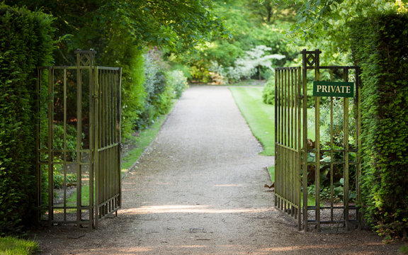 Private Garden. A gated English garden with an anonymous 'Private' sign.