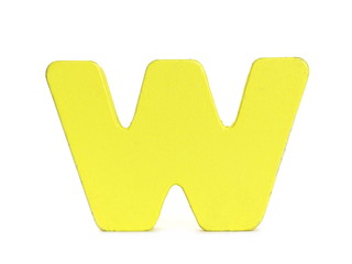 Yellow wooden alphabet letter w isolated on white background