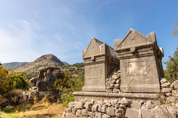 Fototapeta na wymiar A pair of finely carved and inscribed sarcophagus tombs at Sidyma, Turkey.
