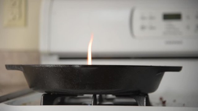 Fire in Cast Iron Skillet on Stovetop 60fps