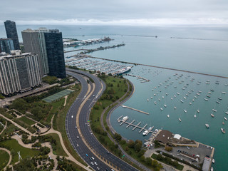 Drone image of Chicago Lake Shore Drive looking out over Lake Michigan at Monroe Harbor with Navy...