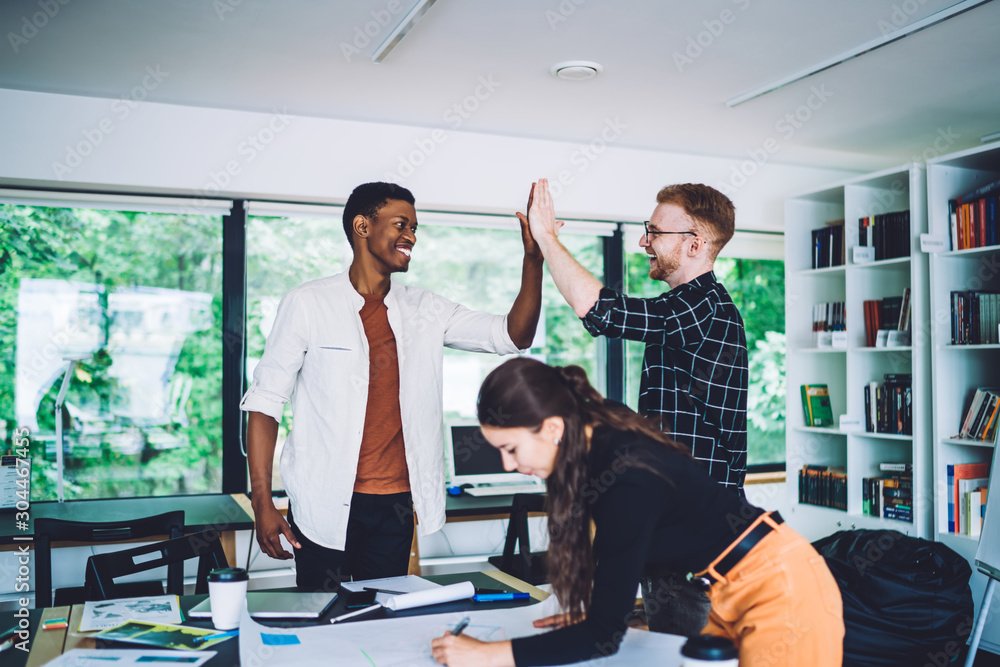 Sticker Cheerful diverse coworkers giving high five