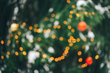 Christmas tree uotdoor with lights and shine, prepare for christmas holiday. blurred background.