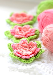 Needlework. Beautiful knitted flowers. Crochet. Roses. Pink flowers.