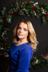 Beautiful woman with in a New Year s interior. Christmas Eve.