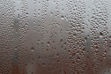 drops of water run down the glass, condensate