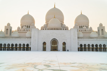 Panoramic view of Sheikh Zayed Grand Mosque, Abu Dhabi, United Arab Emirates. The third biggest mosque in the world. Blue sky sunny day.