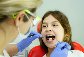 Dental treatment for a child in the dentist’s office.