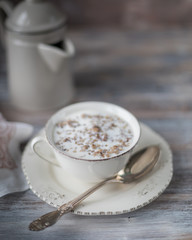 Buckwheat porridge with milk on wooden background. Copy space