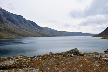 Fototapeta na wymiar Water Level View (looking North) of the Blue Lake Bessvatnet from the Besseggen Ridge Trail, Jotunheimen National Park, Norway (Summer)