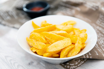 Golden French fries potatoes ready to be eaten