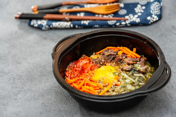 Bibimbap Rice, vegetables, minced marinated beef, spicy sauce and egg yolk