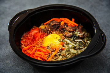 Bibimbap Rice, vegetables, minced marinated beef, spicy sauce and egg yolk