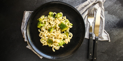 pasta broccoli, vegetarian dish (main course with vegetables Cavatappi, Elbow) menu concept. food background. top view. copy space