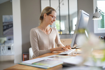 young businesswoman with glasses in an office