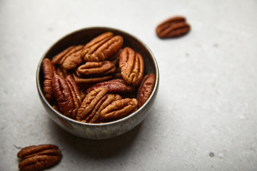 Delicious pekan nut on a bright background