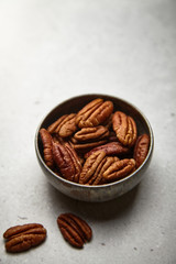 Delicious pekan nut on a bright background