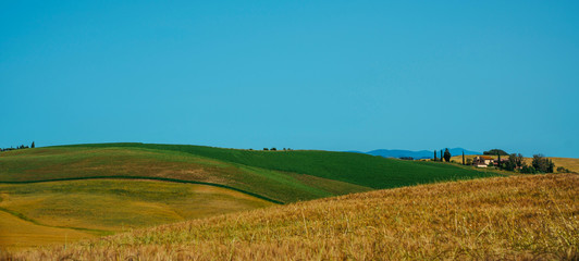 Obraz premium Beautiful spring landscape in Tuscany, Italy. Tuscany village on a morning. Vintage tone filter effect with noise and grain.