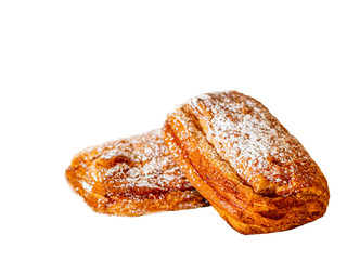 Buns with condensed milk and sprinkled with powdered sugar on a white background.