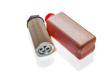 Industrial oil bottle with filter on a white background.