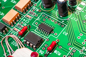 A green chip with a complex circuit for controlling robots.