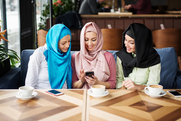 Young muslim woman in the restaurant