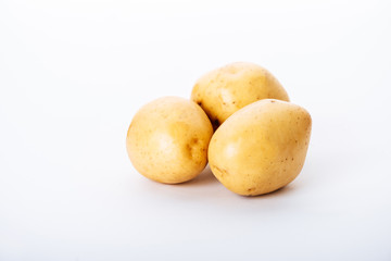 organic raw potatoes on white background