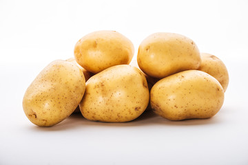 organic raw potatoes on white background