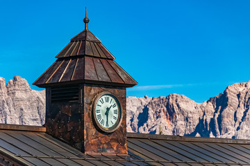 Beautiful alpine view with a clock tower at Leogang, Tyrol, Austria