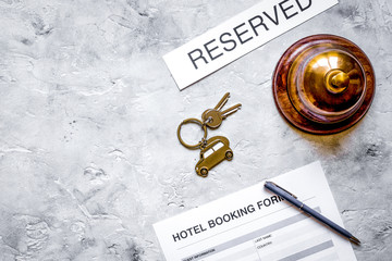 booking form for hotel room reservation stone background top view space for text