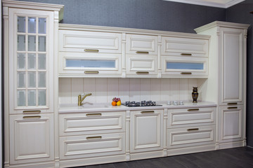 Modern wooden white kitchen in the interior