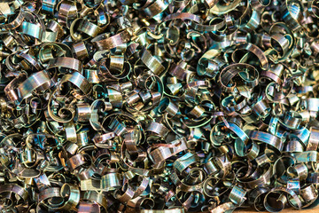 Industrial waste in the form of sharp metal chips. Industrial metal debris.