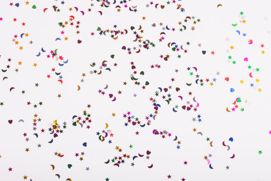 white background with lots of sequins of different shapes