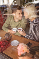 Couple having tea in the small cafe