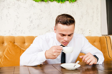 Businessman drinking a cup of coffee
