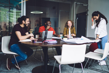 Young diverse students working on project