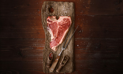 raw tbone steak for blessing day and christmas holidays. A piece of fresh organic farm meat