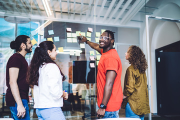 Laughing multiracial students creating plan