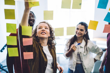 Content young students planning project in office