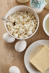 top view of fresh organic dairy products and eggs on wooden table