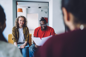 Coworking young students with papers
